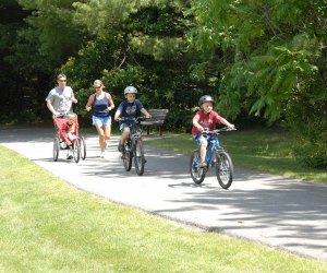 family biking on path Westchester North County Trail 