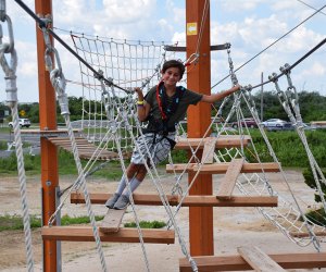 boy on ropes course at Wildplay