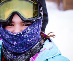 Masks up and jackets zipped! Make sure kids have proper layers for skiing.