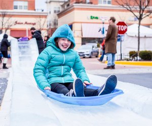 Take a slide on the ice at Winter Ice Festival. Photo courtesy of the Village at Leesburg