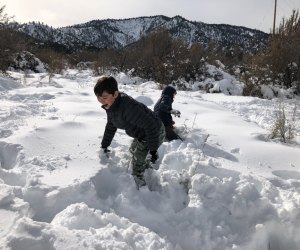 Visit Wrightwood and let your SoCal kids play in piles of pristine snow. Photo courtesy of Mommy Poppins