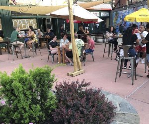 people dining on the patio at yonkers brewing company 