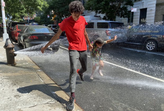 Free things to do in NYC this summer: Hit up the local fire hydrant for one of our favorite free summer activities in NYC