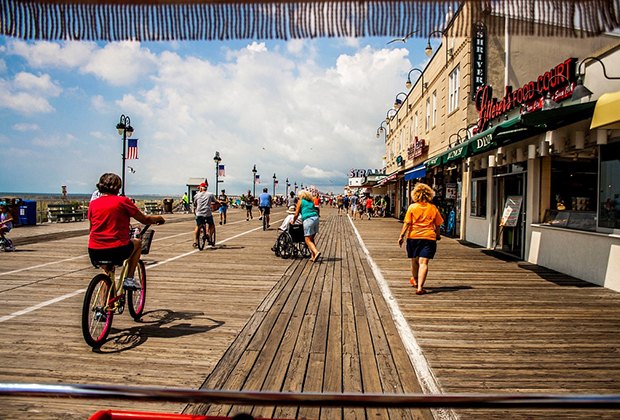 Ride a bike along the ocean on the Ocean City Boardwalk