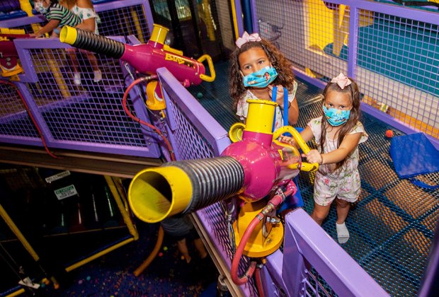 two girls shoot a bubble blaster