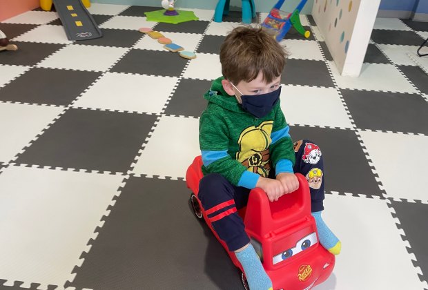 Boy rides kiddie coaster at The Kiddie Clubhouse