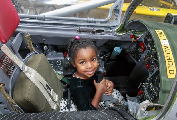 Image of child in airplane cockpit - Things To Do in Hartford