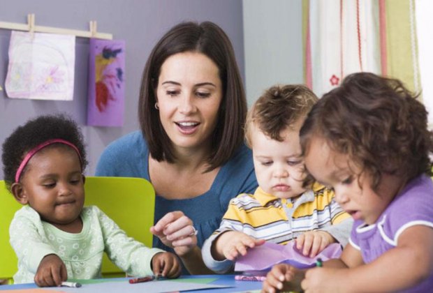 How to Pick a Daycare That You Actually Love Teachers that are fully engaged in play make kids and parents happy. Photo via Bigstock