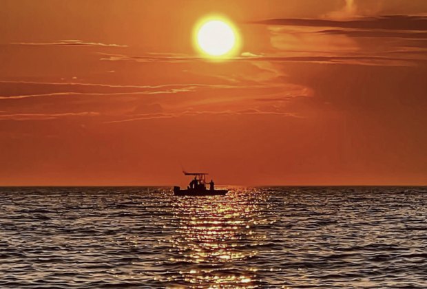 Photo of sunset on the ocean off Cape Cod.