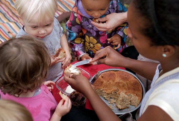 Kids gather around for snacks a the Broooklyn Forest nature preschool