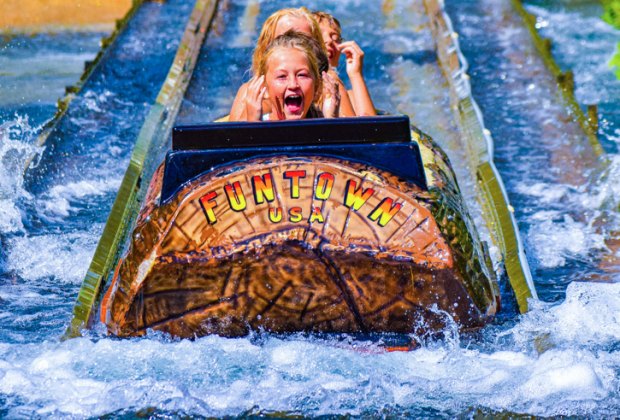 Photo of children on a log flume at fun town-splashtown in Maine. New England water parks, slides, splash-features, floats, wave pools, lazy rivers, slides, Summer fun