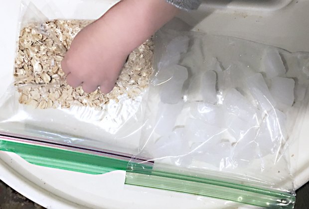 Turn a Highchair into a Baby Activity Center: Oatmeal and ice make sensory bags.