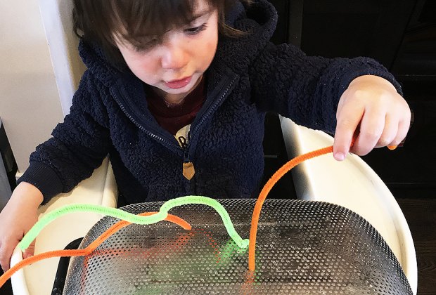 Turn a Highchair into a Baby Activity Center: A great pincer grasp activity.