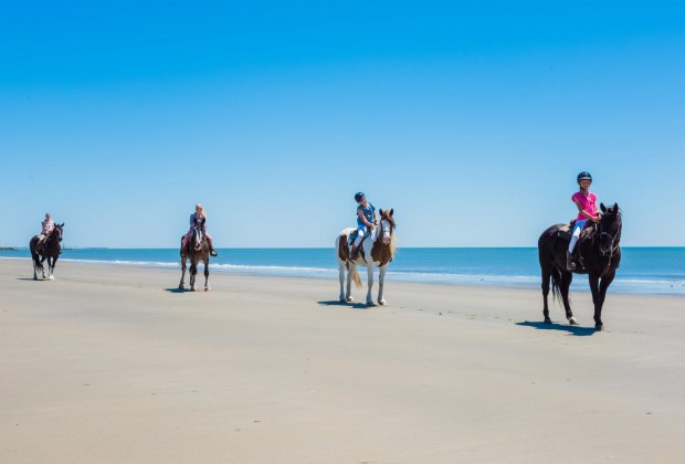 Horseback riding on the beach.