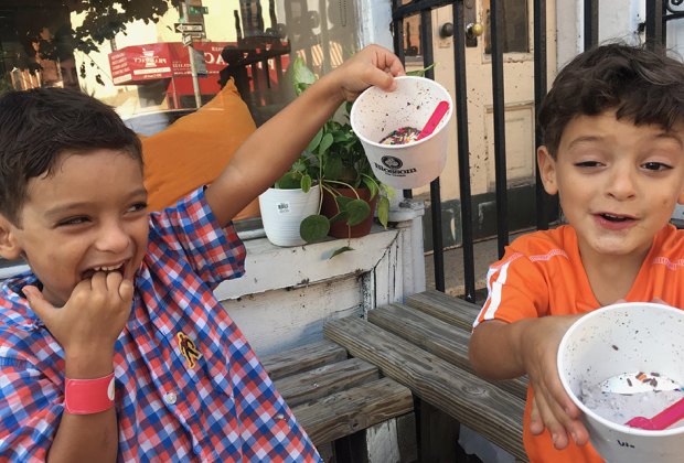 Things to do in NYC this summer: Two happy kids eating ice cream