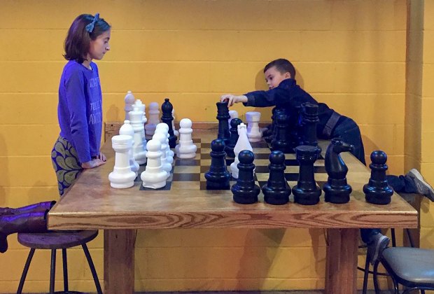 Image of children playing chess - Family-Friendly Breweries in Connecticut