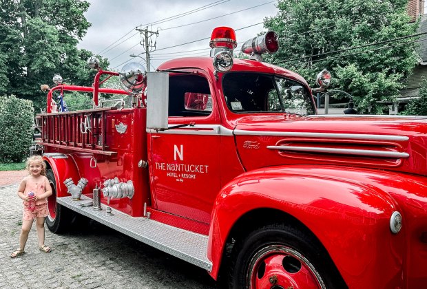 Image of child next to fire engine - Visiting Nantucket