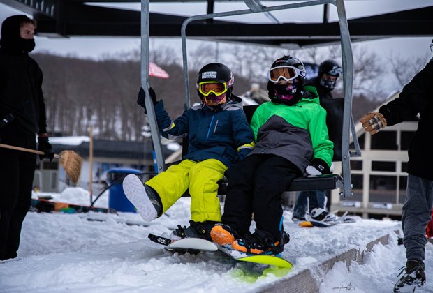 Big Boulder/Jack Frost snowboarders taking the chair lift Best Snowboarding NYC