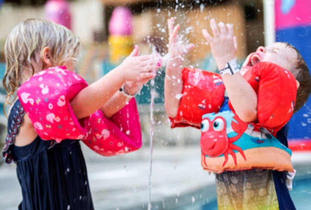 Ways to Keep Cool in a Heat Wave in Philly toddlers splashing in sprinkler