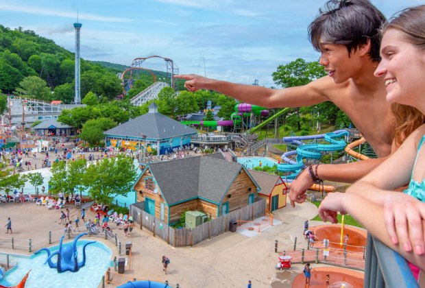 Photo of people looking at rides while visiting Lake Compound Amusement Park