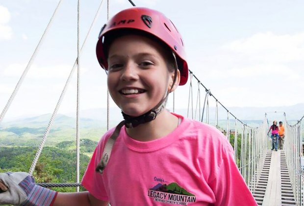 child walking across a sky bridge