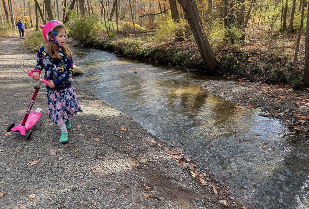 Girl with a scooter at Loantake Brook