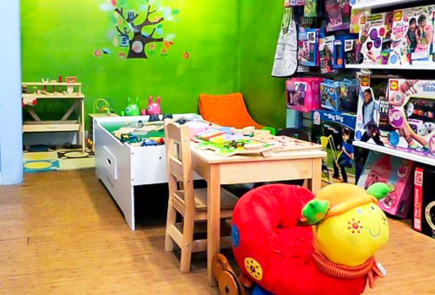 Image of magic beans' indoor places to play, with activity table and toys.