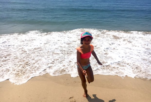 Girl playing in the surf at Montauk's Kirk Beach Park: Best Cute Town on Long Island