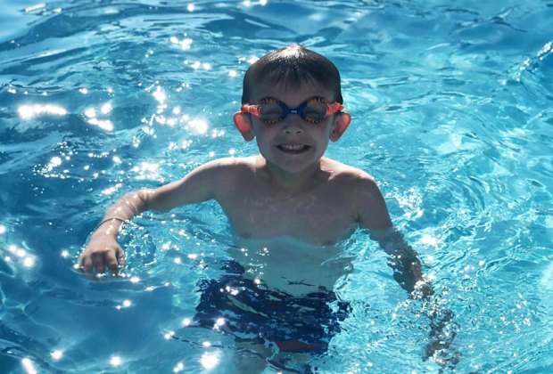 Best Orlando Pools with Day PassesL Boy swimming in pool 