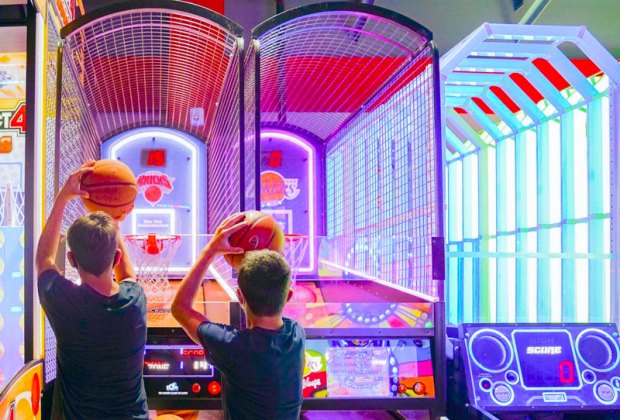 Photo of two kids at a basketball-themed arcade game in CT.