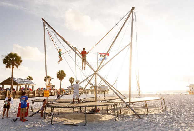 kids doing a bungee trampoline jump on the beach ni clearwater