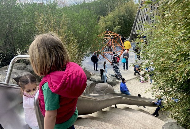 Kids on slide at pier 6 slide valley view of sandy area climbing structures