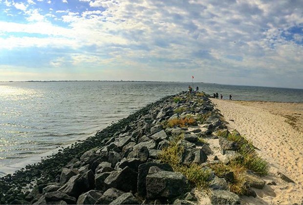 The Shore Parkway Greenway hiking trail leads to the beach