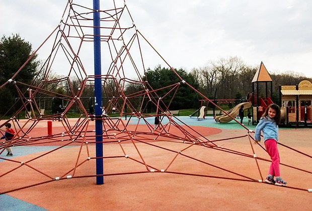 Children climb the rope tower at Ponderosa Park