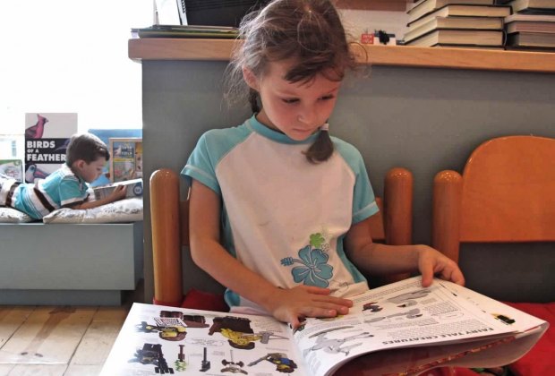 Little girl reading a book