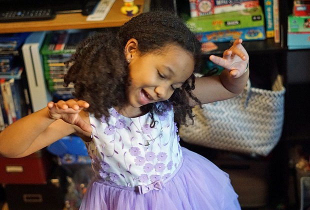 Little girl enjoys a dance break