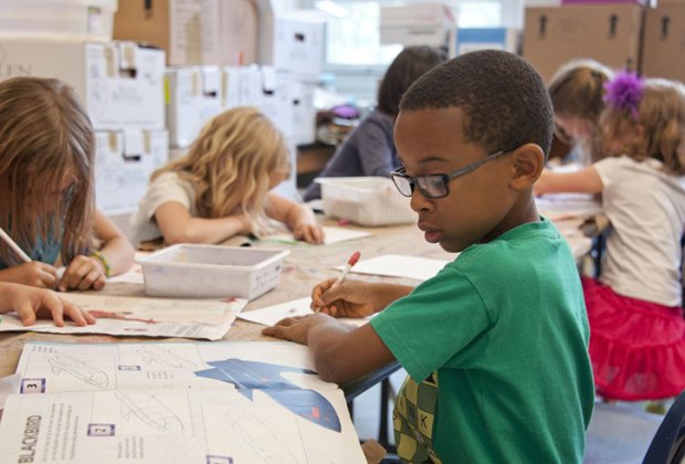 picture of a little boy at school, his parents need the Chicago public schools calendar