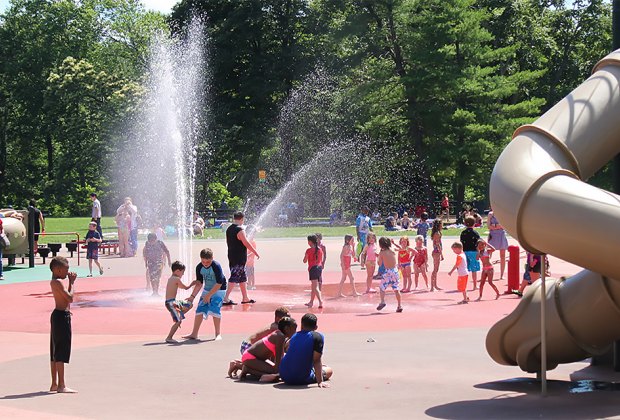 Worth The Drive: 10 Destination Playgrounds in NJ Ponderosa Farm Park has a large water play are set against a backdrop of trees. Photo courtesy of the Scotch Plains Township Recreation Department.