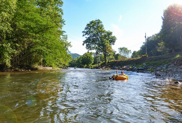 people tubing down a river