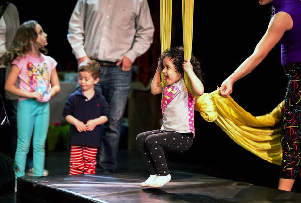 Girl on stage swinging