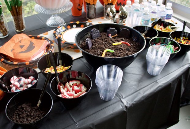 Halloween Party Game Ideas for Tweens and Teens table full of Halloween candy