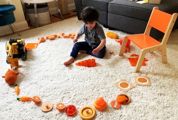 Play easy games, like "Find the orange toys!"