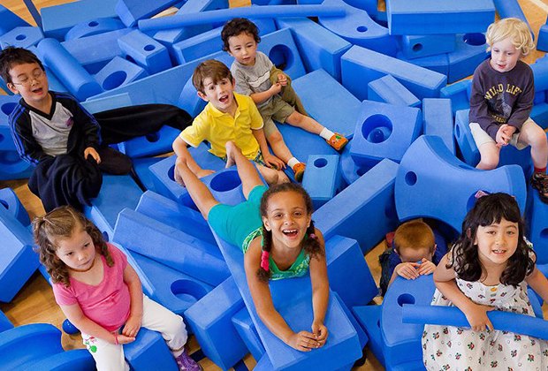 kids playing in blue foam pit