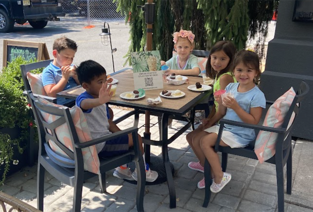 Kids gather around a table at The Compound Coffee Co. in Verona, New Jersey