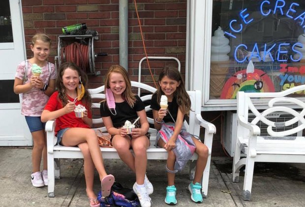 Kids enjoy ice cream cones in front of Verona's The Towne Scoope shop