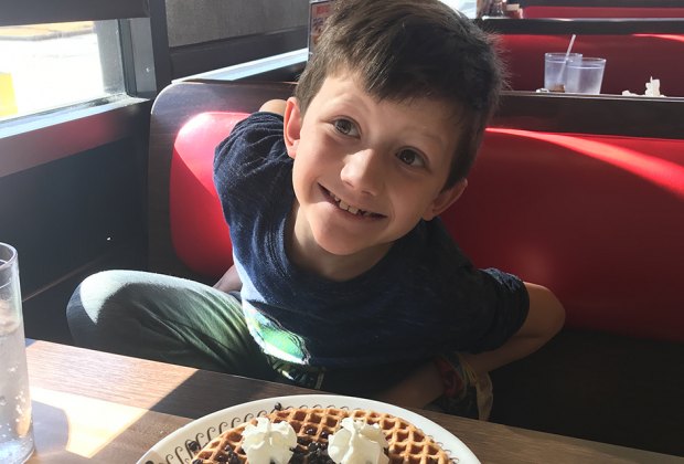 child eating at restaurant Exciting Things to Do on Christmas Day in Atlanta