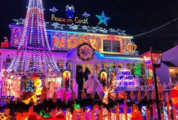 Photo of house covered in holiday lights - Best Neighborhood Christmas Light Displays