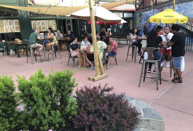 people dining on the patio at yonkers brewing company 