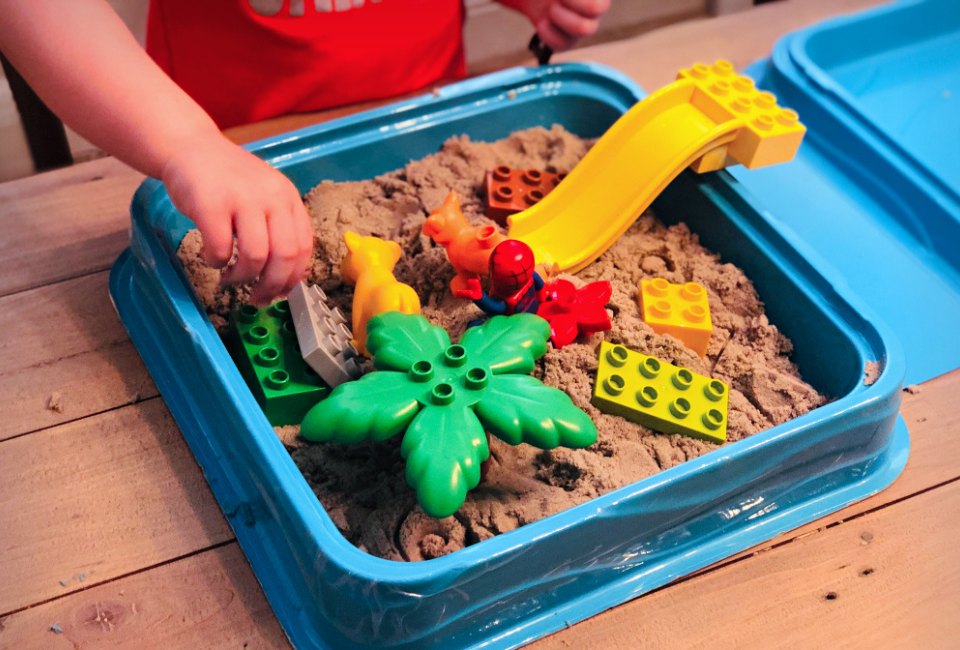 Lego plus sand means a fun sensory bin!