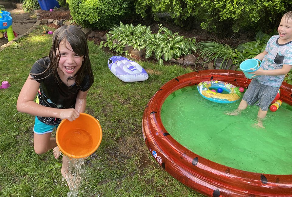 A kiddie pool and some buckets equal tons of backyard fun! Photo by Rose Gordon Sala 